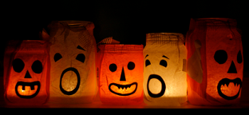[stock photo of halloween faces on lighted bags]